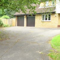 This is what the driveway looked like before. We put in new edgings, granite sets and re sculptured the driveway before surfacing. The finished article is our profile picture.