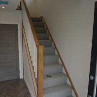 Oak stair case with built in cupboard space underneath. Part of a new build project completed in Keswick.