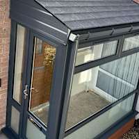 Absolutely brilliant little porch in Glasgow with our insulated solid roof with composite grey slate tiles